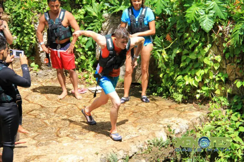 A photo of a man jumping off a cliff adventure