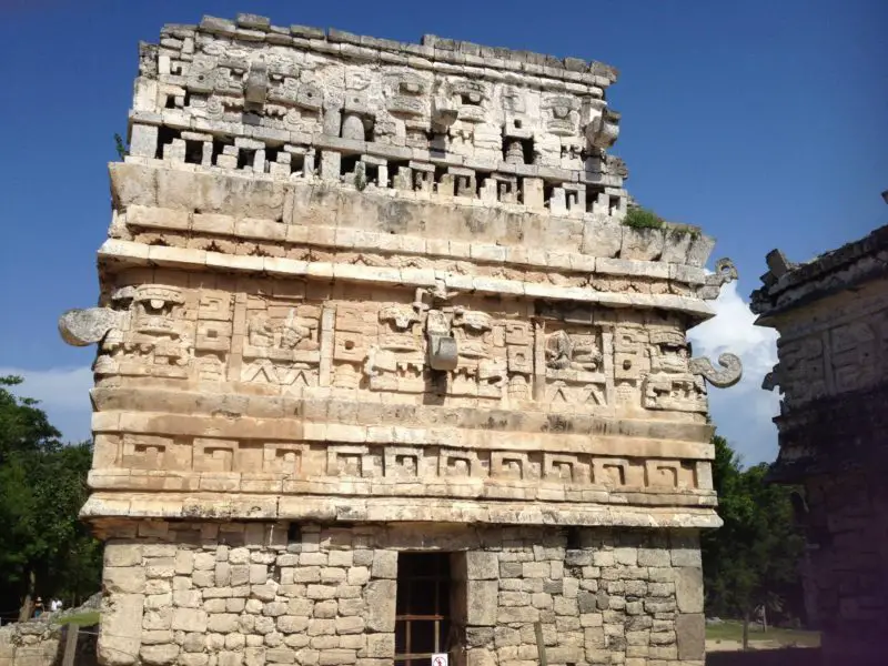 A photo of The face of the sun god carved into one of the landmarks at the Chichen Itza complex in Yucatan