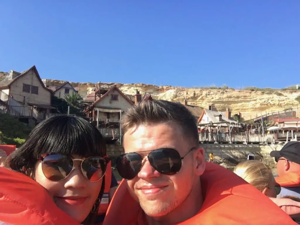 young couple on a boat at Popeye Village