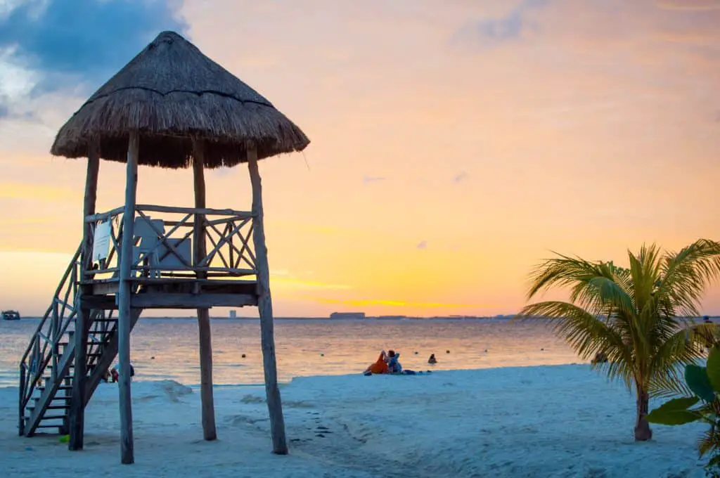 A photo of safeguard tower on the beach at sunset