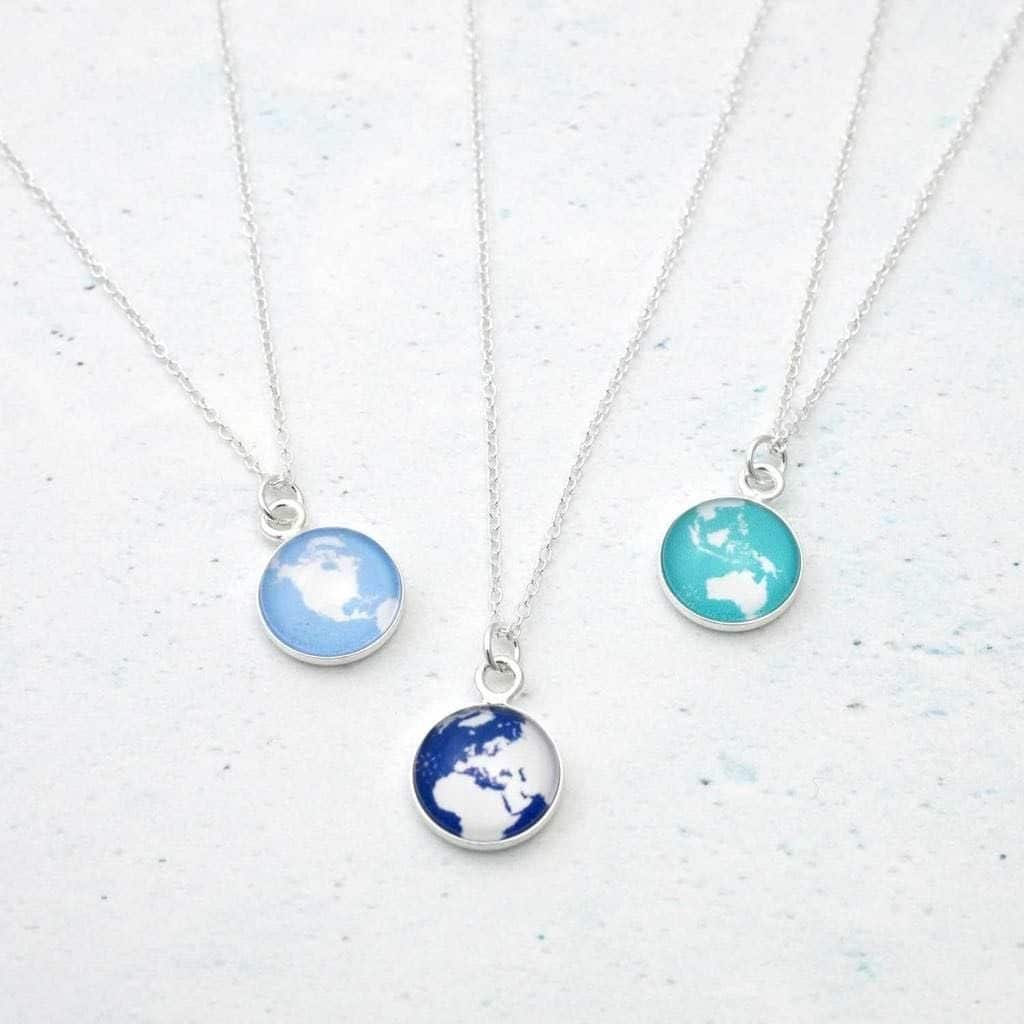 three personalized globe necklaces