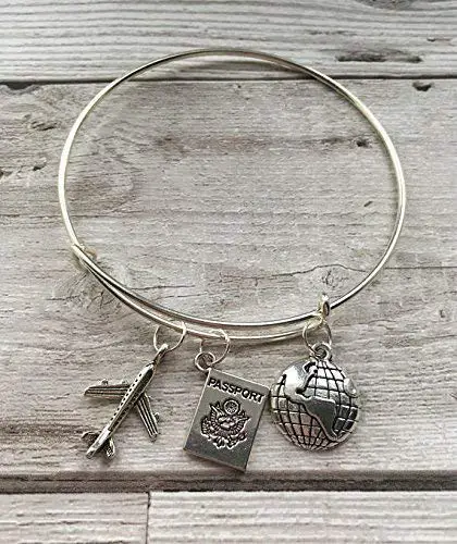 travel themed bangle with plane, passport and globe icons