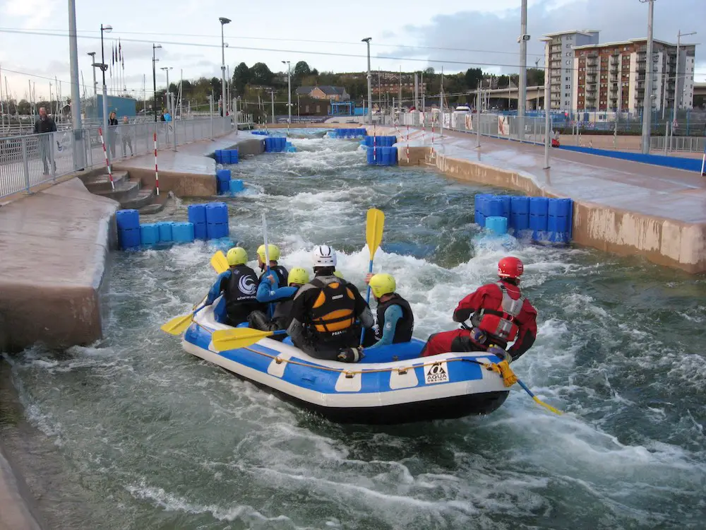 a dinghy full of rafters during white water rafting activity