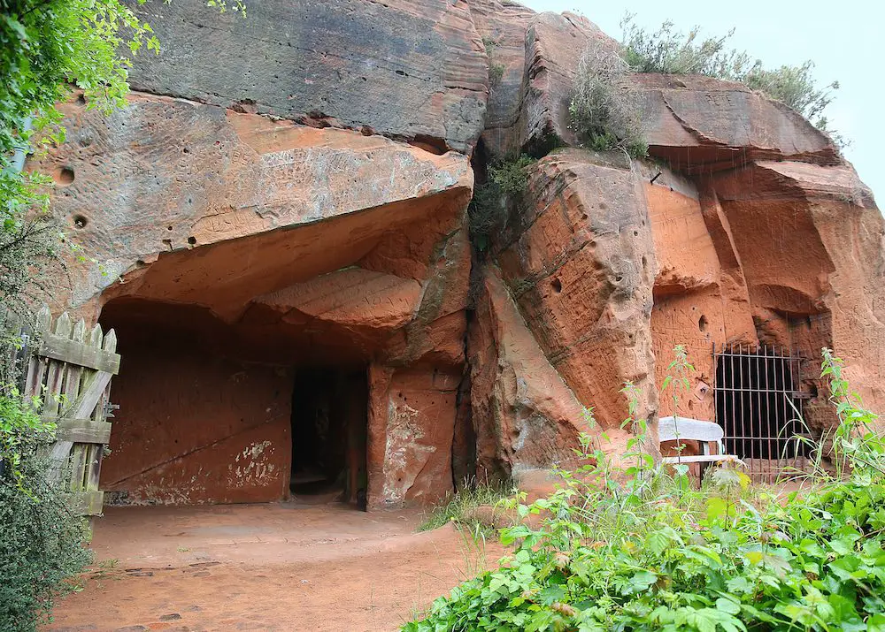 an ancient house built into the red rocks of kinver edge