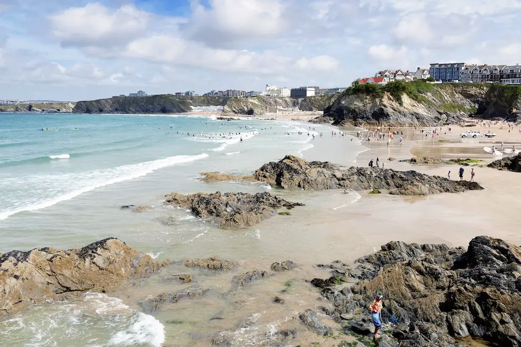 view of the rockpools and sand beach at newquay, cornwall