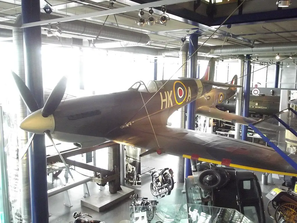 a photo of a spitfire plane raised inside the thinktank museum