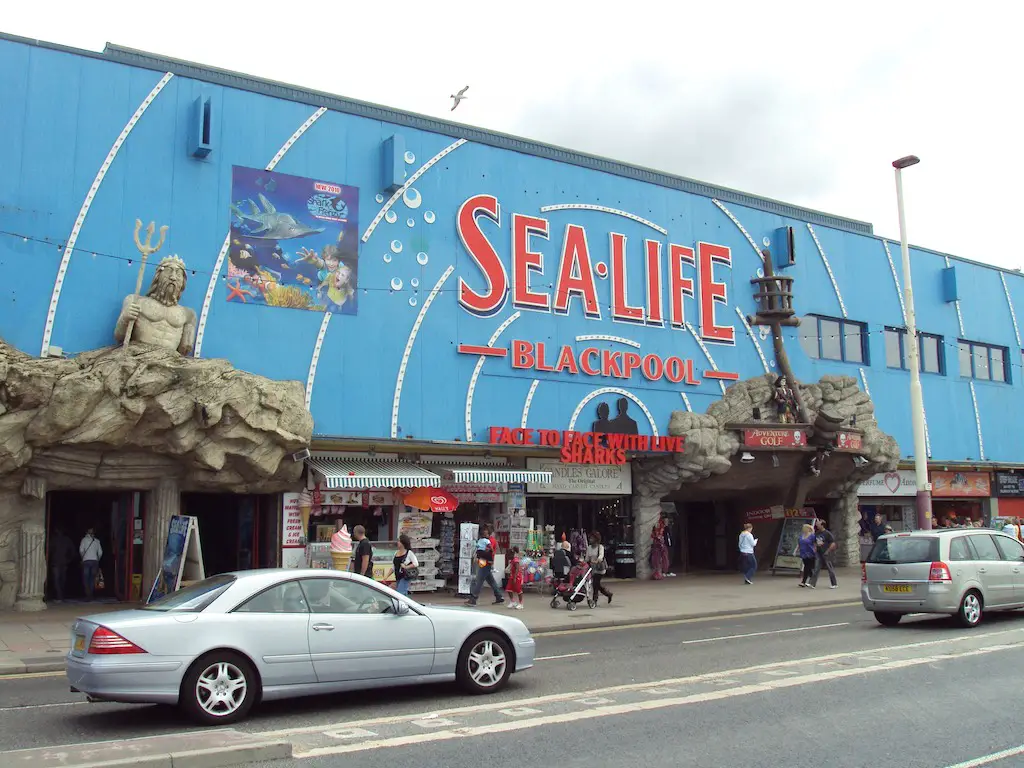 the bright blue front entrance of the sea life centre in blackpool, england