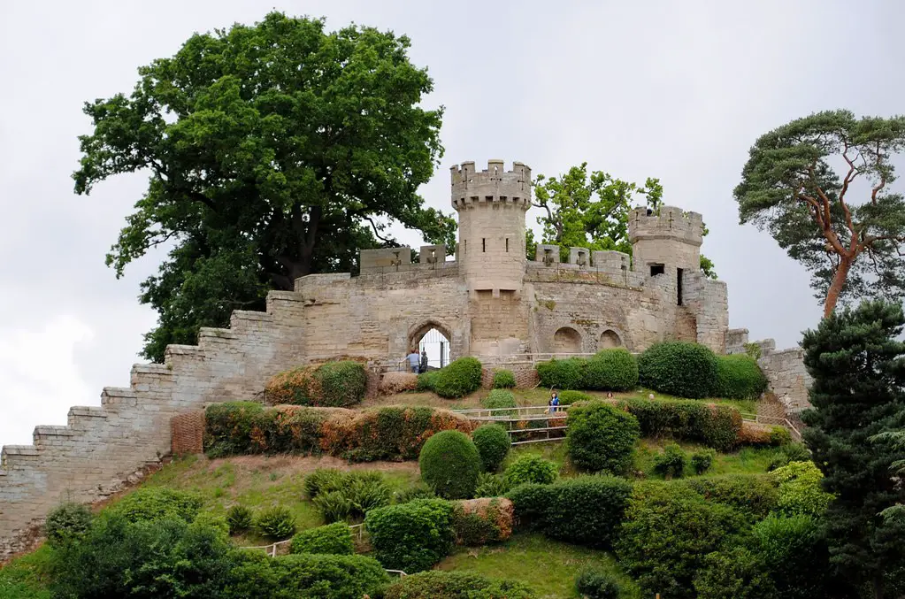 view of the castle and gardens at warwick castle, england