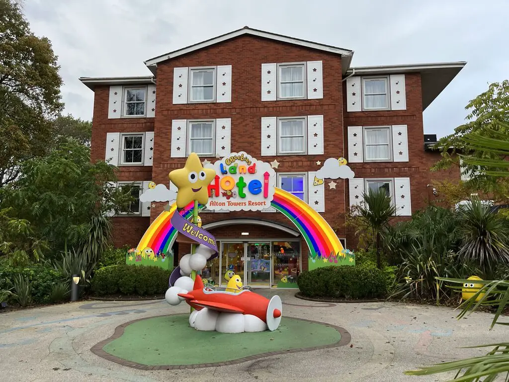 front view of the Cbeebies Land Hotel with rainbow decoration at the main entrance, at alton towers resort