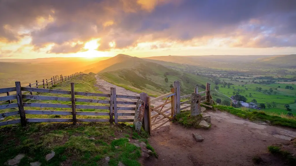 sweeping views of mam tor landmark at the peak district in england during sunset